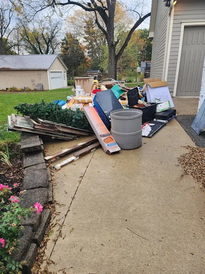 Dumpster being loaded with debris for Residential Dumpster Rental in Moab